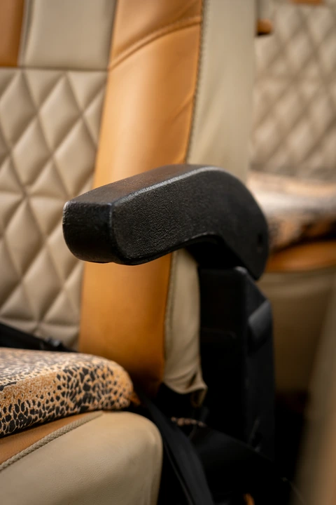 Close-up of a padded armrest inside the safari vehicle