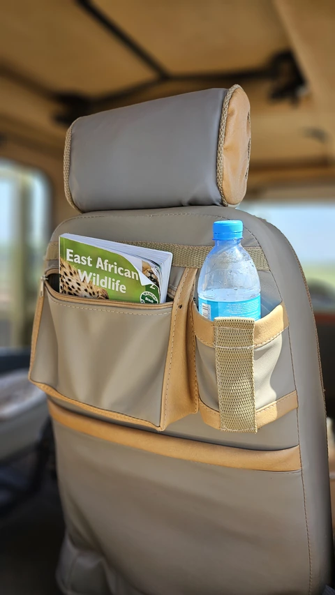Seat pockets with a wildlife guidebook and drinking water
